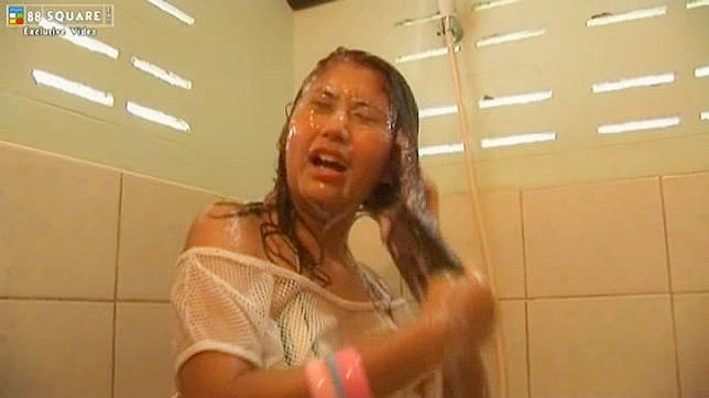 April Lim rides a big dildo during her lonely kinky shower