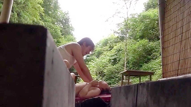 Submissive Woman Succumbs to Domination During Public Humiliating Act
